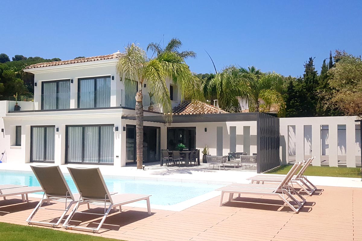 Modern villa with pool and palm trees