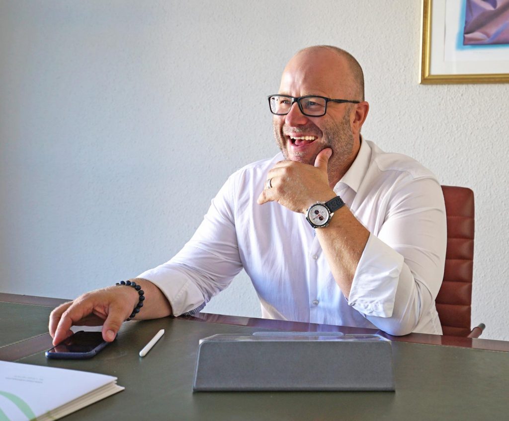 Man sitting at a desk.